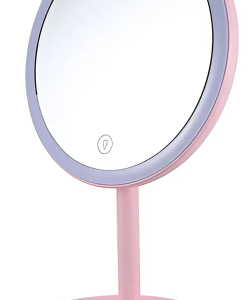 Espejo de maquillaje circular con luz LED, base de soporte en color rosa y botón táctil en la superficie.